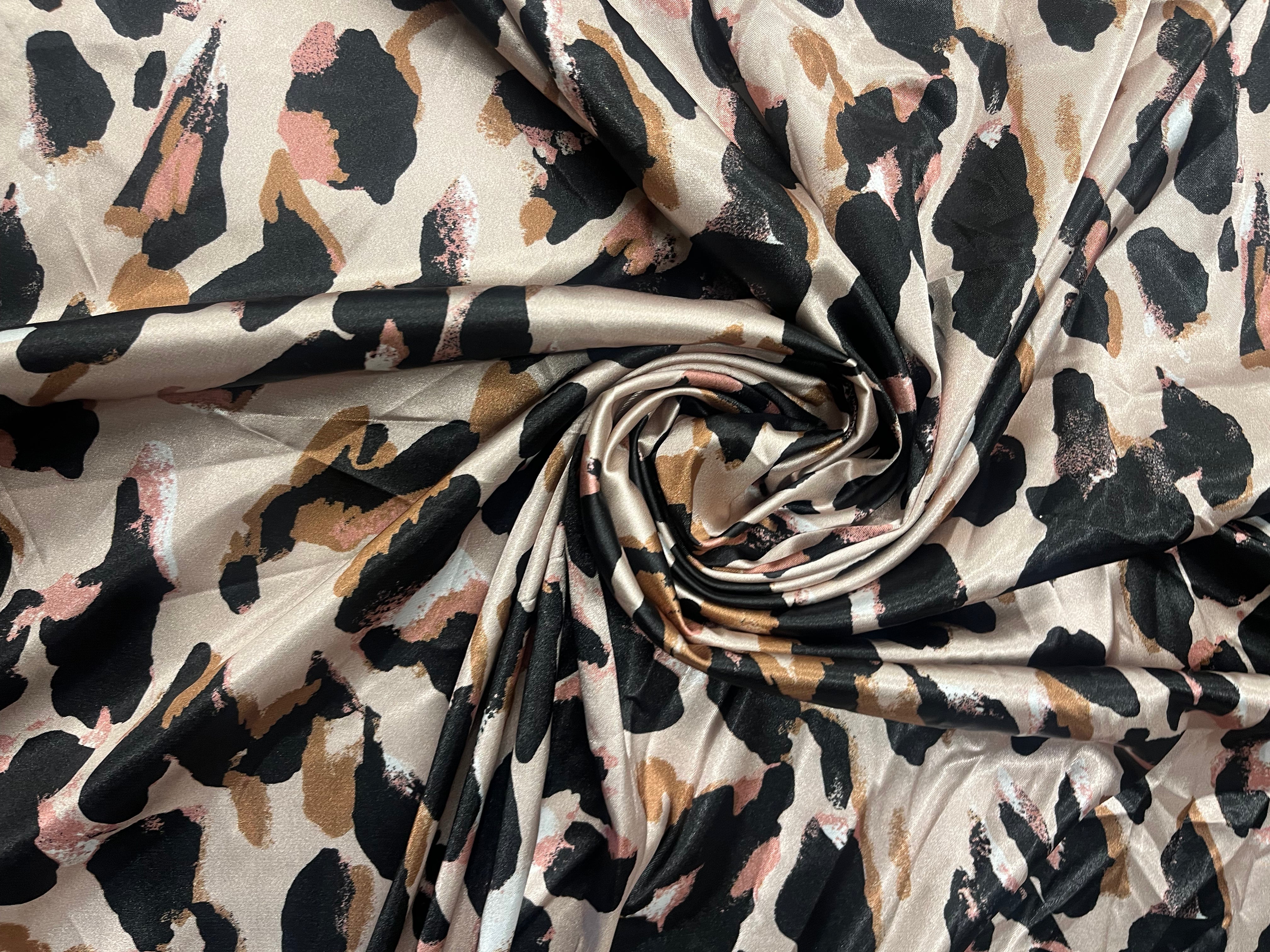 Abstract leopard print satin fabric in neutral tones